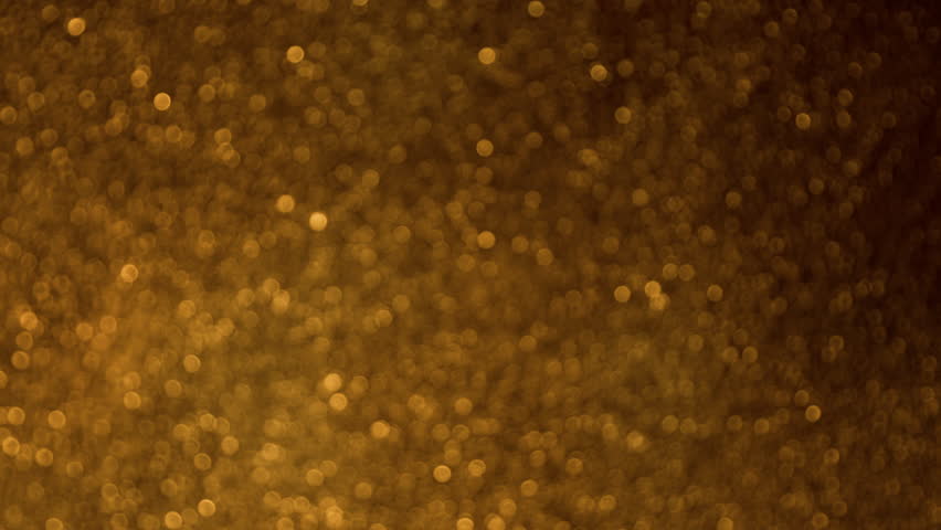 Super Slow Motion Shot of Glittering Golden Background at 1000fps.