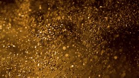 Super Slow Motion Shot of Glittering Golden Background at 1000fps. - Powered by Shutterstock - Get 15% off with code: PIKWIZARD15