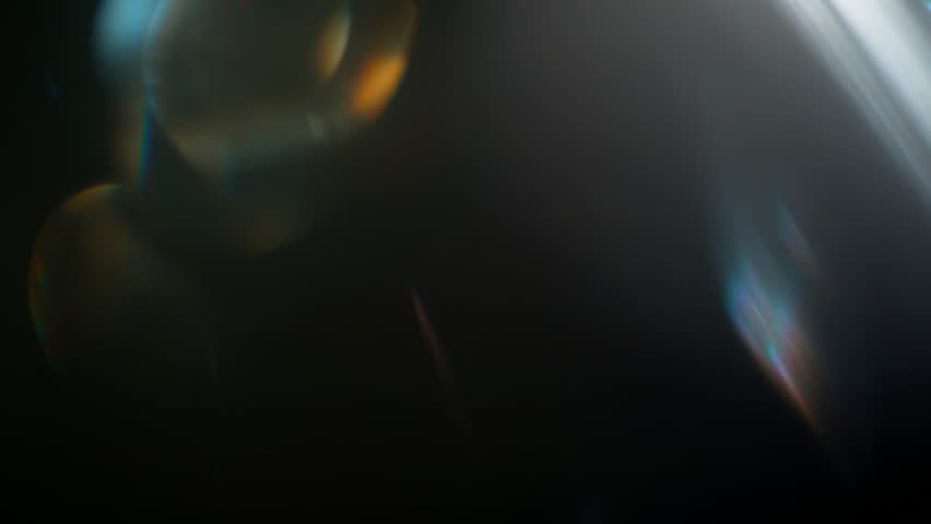 Real Shooted Cinematic Lens Flare Overlay on Black Background at 1000fps Slow Motion.