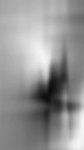 Blurry figures in grey background, suitable for abstract concepts in design projects, evoking mystery and uncertainty in artistic creations.