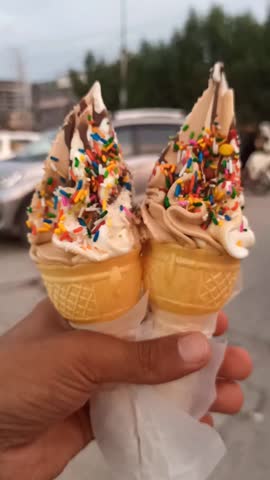 ice cream cone, Male Hand Holding Vegan Ice Cream, Icecreame outdoor, Man Holding increame on road, Icream closeup view, Ice Cream Portrait Shot