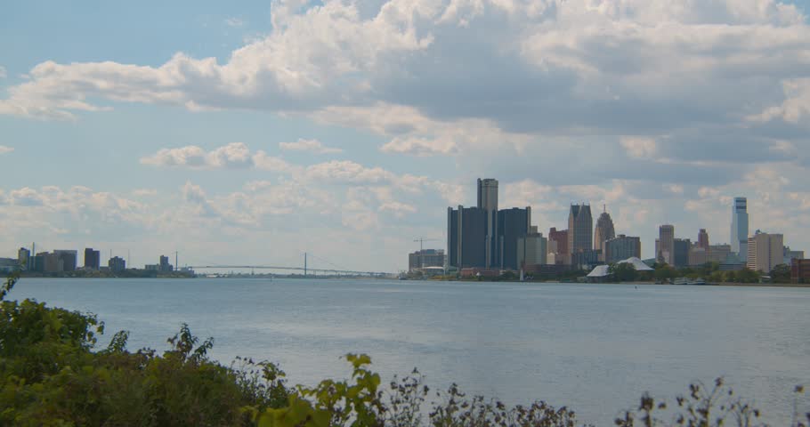 Black male taking in view of downtown Detroit and the Detroit River