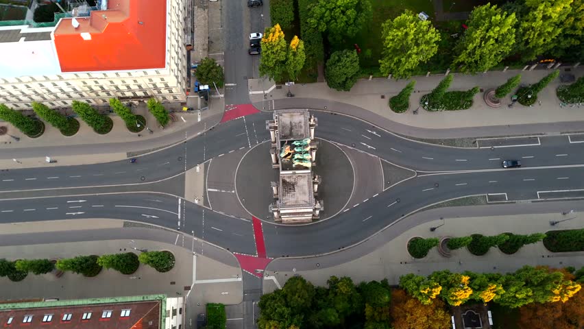Munich aerial panorama at sunrise featuring Siegestor, iconic triumphal arch, Bavaria with lions, Ludwigstrasse, Munich, Germany, perfect for cinematic cityscapes, European architecture, and travel