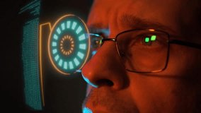 A side view of a man wearing glasses with digital HUD elements projected before him. The futuristic imagery represents cyber security, virtual reality, and technology innovation. - Powered by Shutterstock - Get 15% off with code: PIKWIZARD15