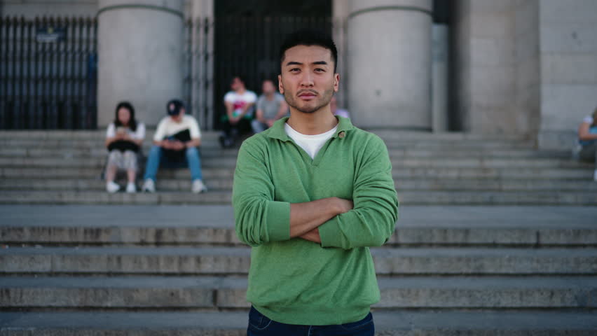 Close-up portrait of young man with intense serious gaze, representing strength, confidence, and individuality in modern masculine identity and lifestyle concepts