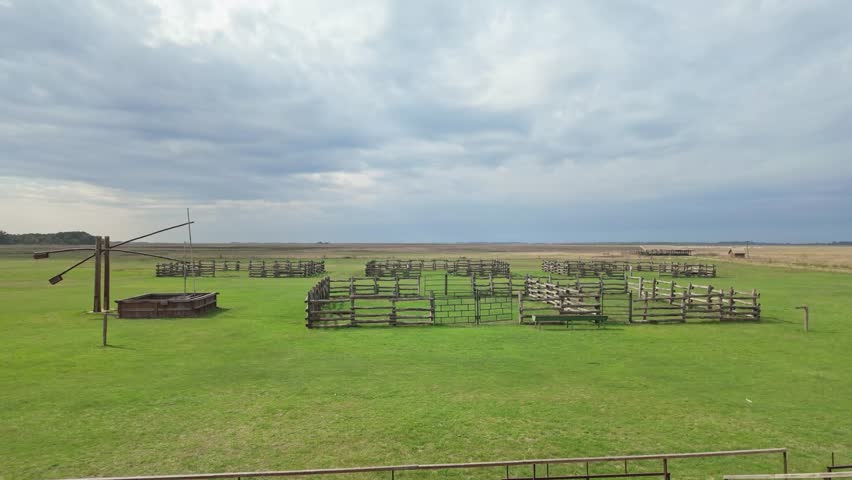 Gorgeous landscape view of the Great Plain with a traditional draw well and empty corral on Hortobágy in Hungary.