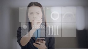 Asian businesswoman using stylus and smartphone to interact with multiple virtual dashboards. Concept of data-driven decision, financial analysis, and digital transformation. - Powered by Shutterstock - Get 15% off with code: PIKWIZARD15