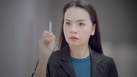 Asian businesswoman using futuristic digital dashboard with graphs, charts, and world map to analyze business data. Concept of global strategy and data analytics. - Powered by Shutterstock - Get 15% off with code: PIKWIZARD15