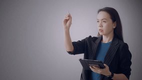 Asian businesswoman analyzing global data using virtual dashboard with interactive world map and digital percentage charts. Concept of global control and smart business. - Powered by Shutterstock - Get 15% off with code: PIKWIZARD15