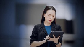 Asian businesswoman analyzing virtual business dashboard with interactive charts and metrics, featuring video player overlay. Ideal for data-driven strategy, SaaS, and analytics training scenes. - Powered by Shutterstock - Get 15% off with code: PIKWIZARD15