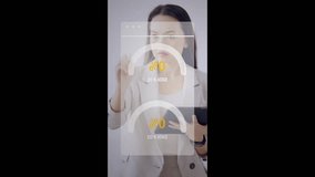 Asian businesswoman analyzing data on futuristic augmented reality interface in vertical format. Ideal for smart business, mobile technology, and digital transformation visuals. - Powered by Shutterstock - Get 15% off with code: PIKWIZARD15