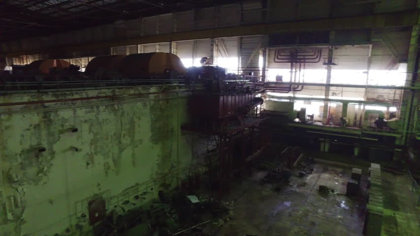 Inside The Damage Turbine Hall Of Chernobyl Nuclear Power Plant After The 1986 Disaster In Ukraine. Panning Shot