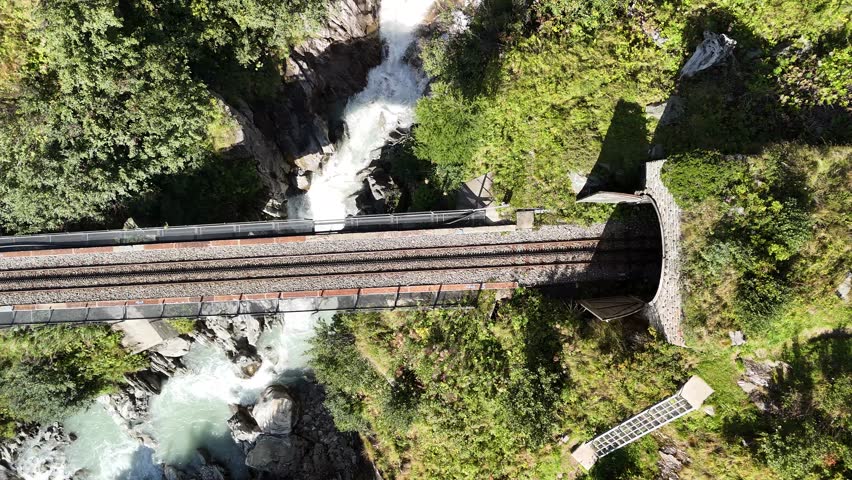 Railway Bridge Through Scenic Mountain Tunnel Over River