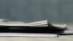 Hand turning pages on notebook close up 4k shot selective focus - Powered by Shutterstock - Get 15% off with code: PIKWIZARD15