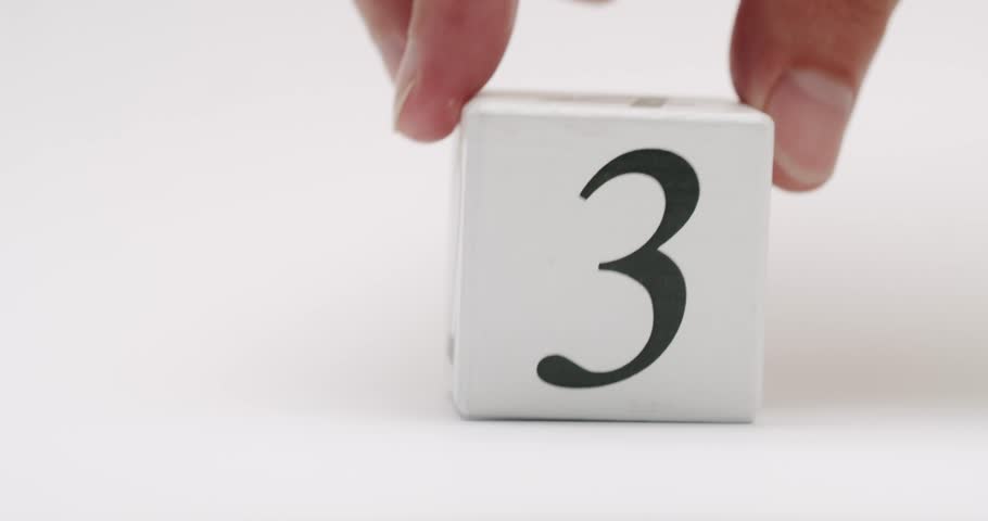 Minimalistic image of a wooden block displaying the number three, isolated on a white background. Wooden Block With Number Three On White Background