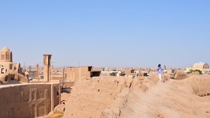 Panning view panorama from Historic castle in Kashan with city buildings background. Explore iran historical heritage concept