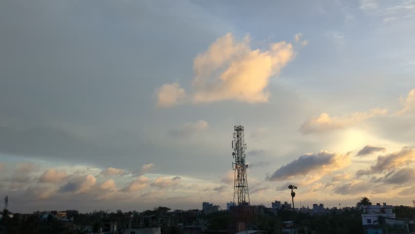 Timelapse Sunset with sun and clouds on blue and orange dramatic sky with sun rays.4k  timelapse. Evening Clouds. Dusk twilight sky time lapse. Dramatic skies