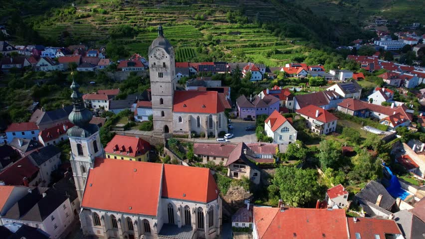 Austria tourism. Danube river boat cruise. scenic landmarks and beautiful villages - charming Krems town in Wachau valley. 4k aerial drone video