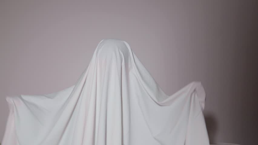 Creative ghost exploration during a spooky Halloween gathering at home