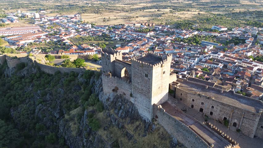 Orbiting aerial view of Luna Castle over the town of Alburquerque in Badajoz. Extremadura, Spain.