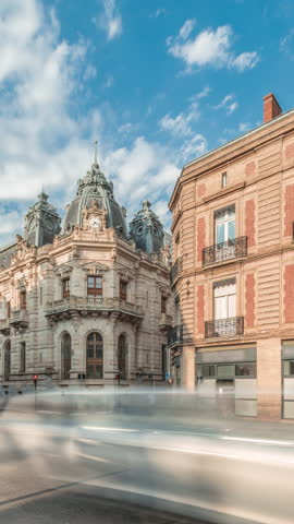 Panorama showing historic brick facades at Rue du Languedoc and Theodore Ozenne intersection timelapse in Toulouse, France. Shops, cafes, road traffic near Carmes metro station in vibrant city center
