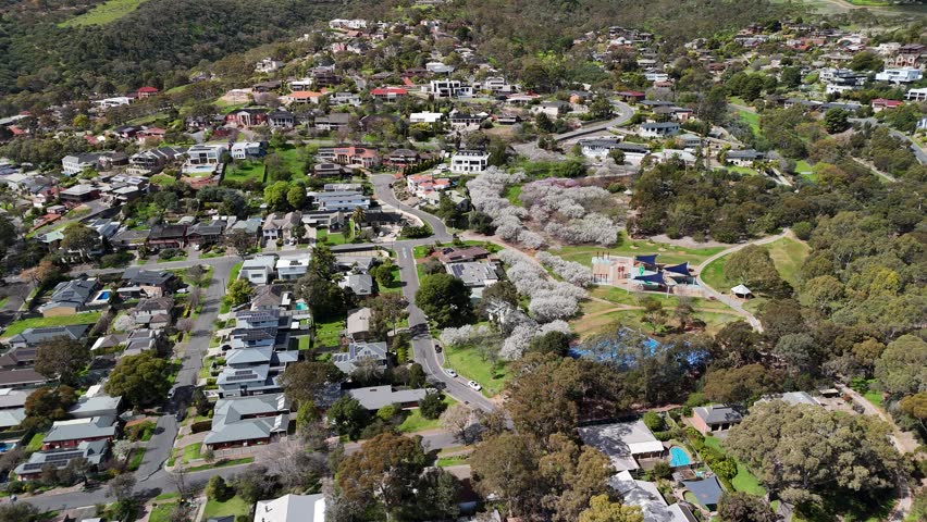 Magill and Auldana, Adelaide, South Australia: 4K Aerial Drone Footage of Residential Suburbs, Low Density Houses with Solar Panels, Gardens, Parks with Plum Blossoms and Adelaide Hills in Spring