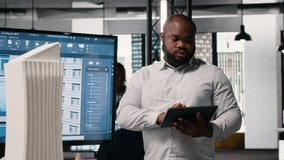 African american real estate developer reviews city planning layout on laptop, setting infrastructure goals while preparing a presentation on sustainable housing urban development. Camera B. - Powered by Shutterstock - Get 15% off with code: PIKWIZARD15