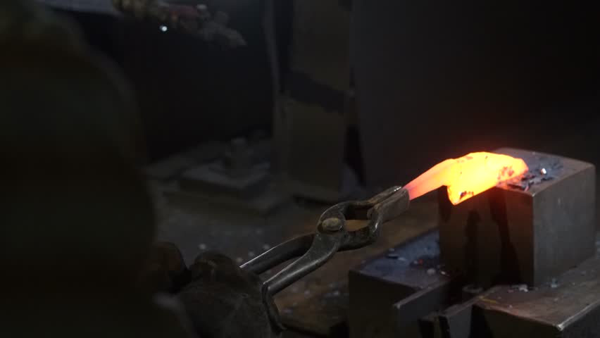 A craftsman who hammers heated materials into shapes
