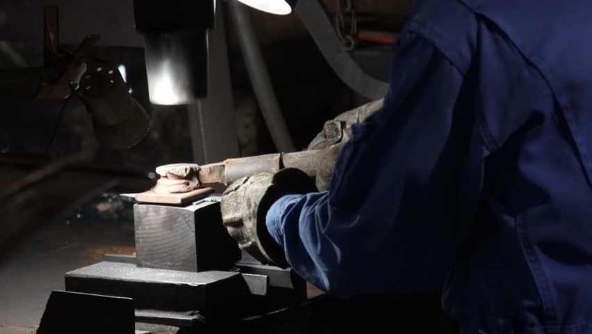 A craftsman who hammers heated materials into shapes