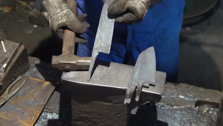 A craftsman who hammers heated materials into shapes