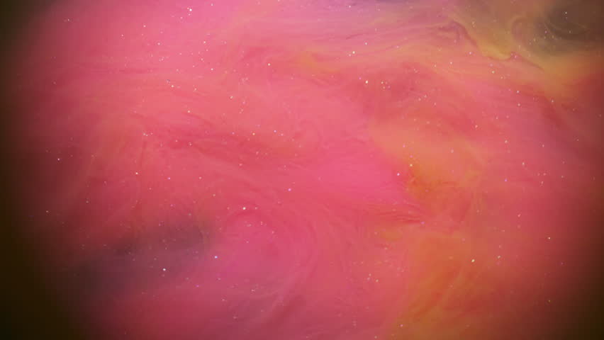 Paint splash. Cloud vapor. Defocused pink yellow color ink swirling shimmering liquid floating on abstract vibrant art background.