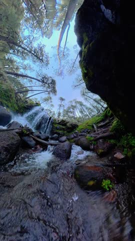 Hiker observes waterfall in iztaccihuatl national park, mexico