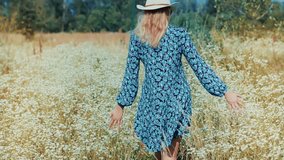 Woman Walking Through Daisy Flower Field. Sunlit Field, Carefree Lifestyle, Summer Vacation. Leisurely Walk, Escape From City. Tranquil Scene, Mindful Living. Tranquil Wildflower Meadow. Flower Meadow - Powered by Shutterstock - Get 15% off with code: PIKWIZARD15