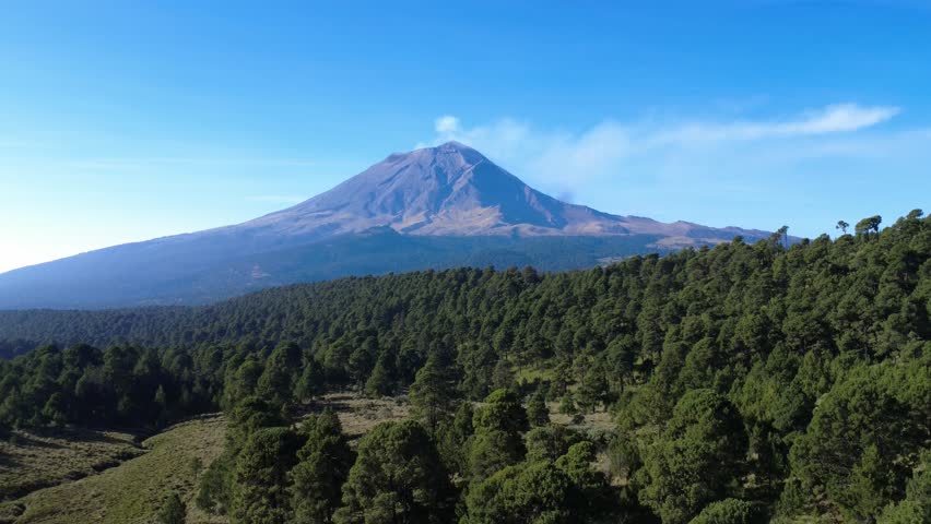 Popocatepetl volcano emits a plume of smoke and ash, viewed from iztaccihuatl national park