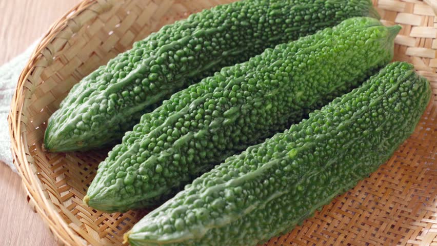 Fresh Bitter Melon (Goya) on Bamboo Colander