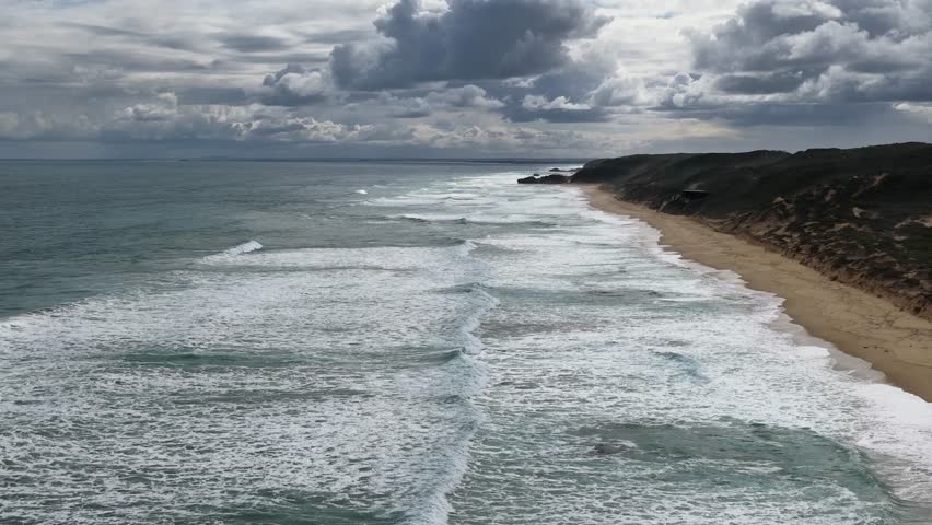 Drone captures dramatic waves and coastline under moody skies at Portsea, Melbourne, Victoria, Australia