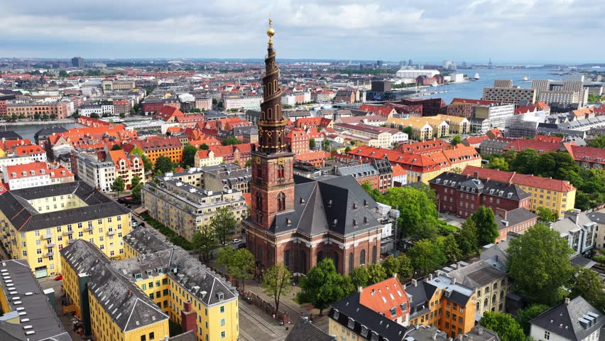 orbiting drone shot of Copenhagen famous church of Our Saviour, aerial view of downtown Copenhagen, capital of Denmark, Danish capital drone view. High quality 4k footage