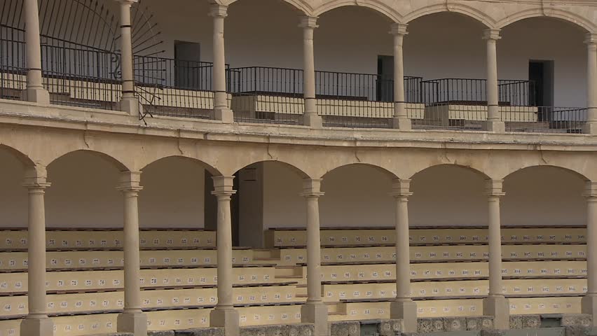 View of the exterior of Plaza de Toros, the historic bullring in Ronda. The circular stone structure reflects the city’s Andalusian heritage and architectural style.