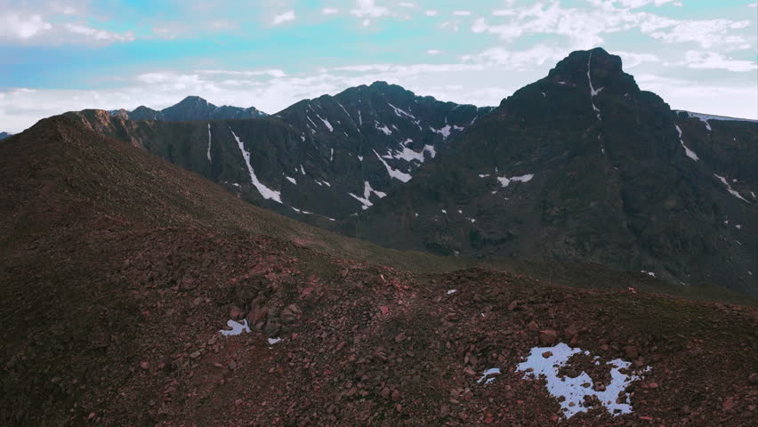 Halo Ridge Notch Mountain shelter landscape view of Mount of the Holy Cross 14er peak wilderness aerial drone Colorado summer afternoon sunset clouds Rocky Mountains Sawatch Range circle left