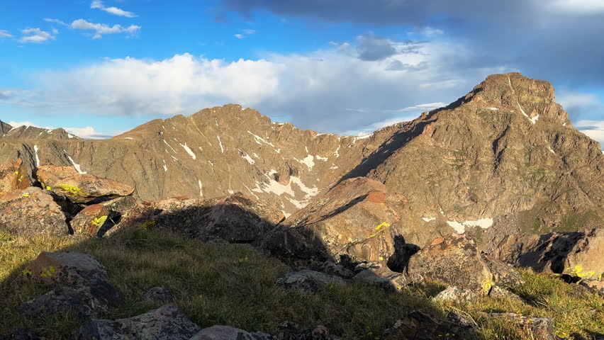 Mount of the Holy Cross 14er peak view from Halo Ridge Notch Mountain shelter spring summer Rocky Mountains Colorado blue sky clouds landscape nature summit snow field cornice pan right