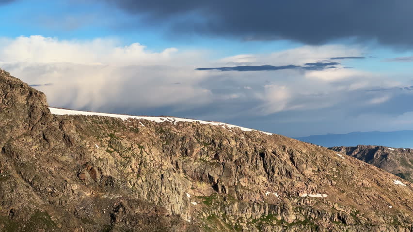 North ridge halfmoon pass trail spring summer Rocky Mountains Colorado blue sky clouds Mount of the Holy Cross wilderness landscape nature view of 14er summit snow field cornice pan left