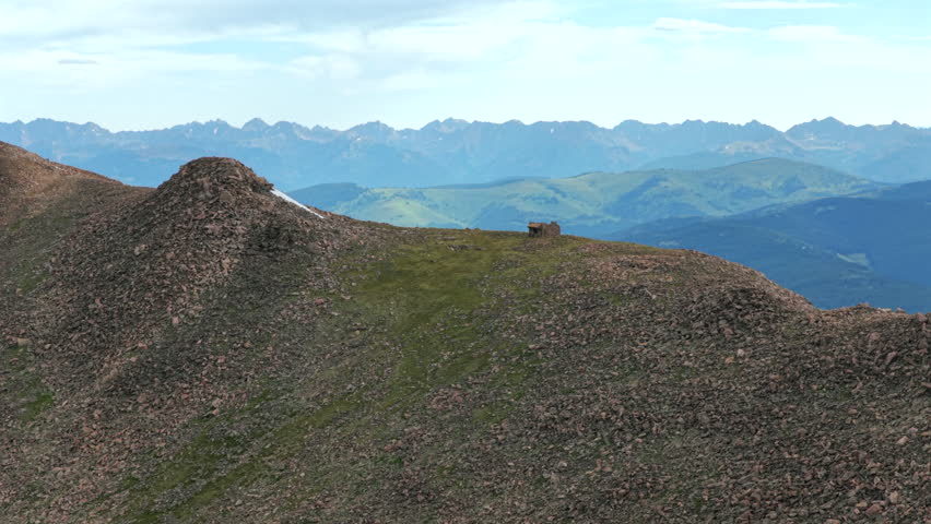 Notch Mountain Shelter morning Halo Ridge Gore Range Vail Minturn Redcliff aerial drone Colorado sunny blue sky summer Mount Holy Cross 14er peak Wilderness Sawatch Range Rocky Mountains forwards pan