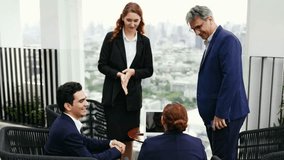 Business professionals in suits shake hands during an outdoor meeting on a terrace with a city skyline, signaling partnership, networking, and corporate collaboration. 4k video - Powered by Shutterstock - Get 15% off with code: PIKWIZARD15
