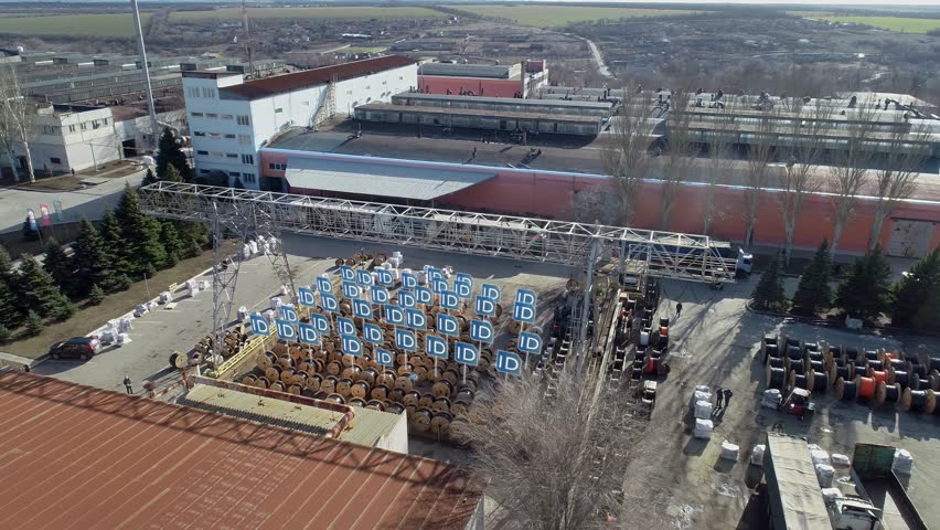 Factories And Industry exterior. Power cable manufacturing plant, exterior. Smart manufacturing, concept. Non-ferrous metal plant aerial view. Cable manufacturing. 