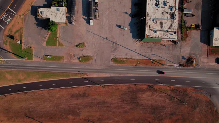 Top-down drone footage reveals bustling truck stop complex with fuel stations, parking areas in Memphis Tennessee