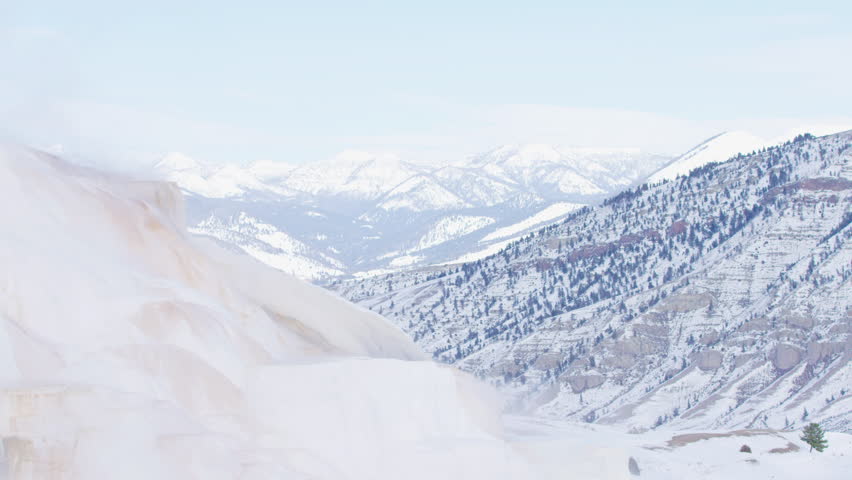 Snowy valley in mountains at winter, Montana, US.
