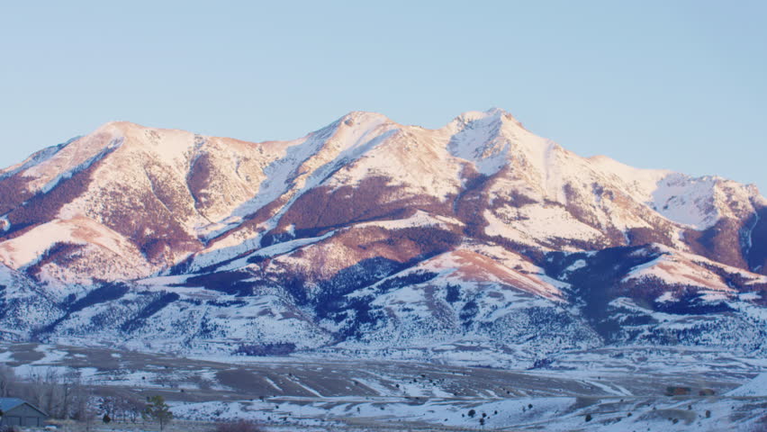 Snowcapped peaks at Yellowstone National park at sunset, Montana, US.