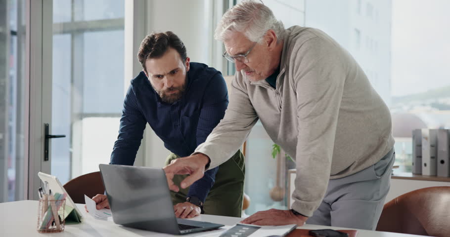 Business, laptop and men in office, teamwork and conversation with copywriting. People, journalist and employees with pc, help and feedback for newsletter, company website layout or online magazine