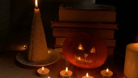 Cozy Halloween scene showcases a glowing pumpkin, flickering candles, and stacked books, enhancing the festive ambiance of the celebration. happy Halloween day concept  - Powered by Shutterstock - Get 15% off with code: PIKWIZARD15