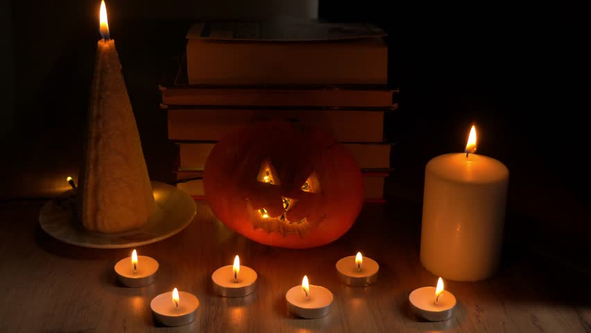 Cozy Halloween scene featuring glowing candles, a carved pumpkin, and stacked books enhancing the festive ambiance. happy Halloween day concept 